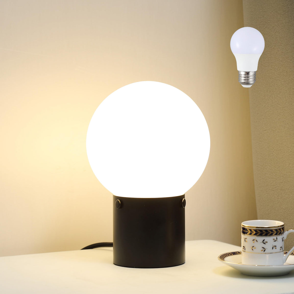 Somniferous small table lamp nightstand globe offers a soft glow ideal for nighttime reading.