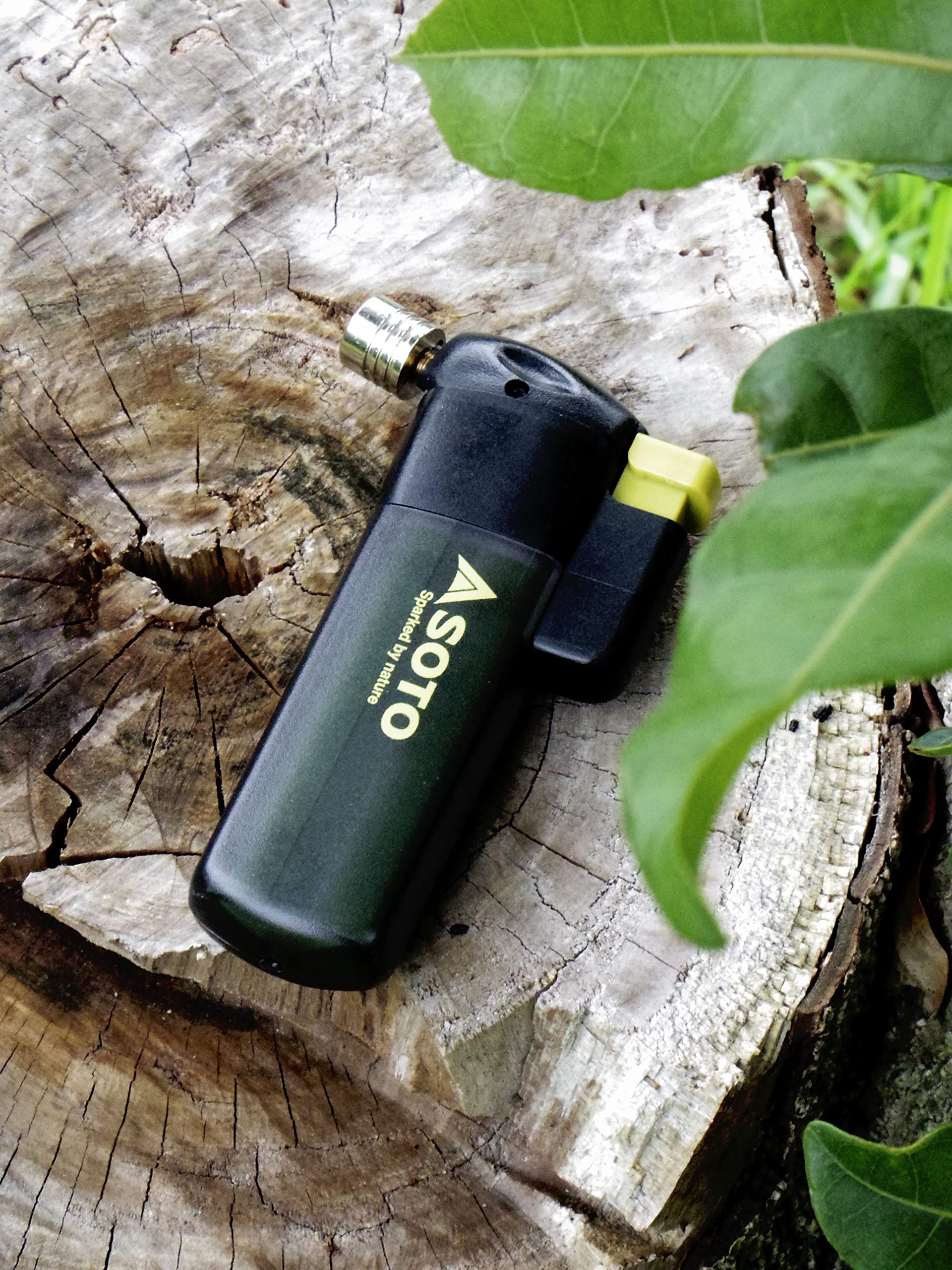 SOTO compact torch resting on a surface highlights portable lightweight design