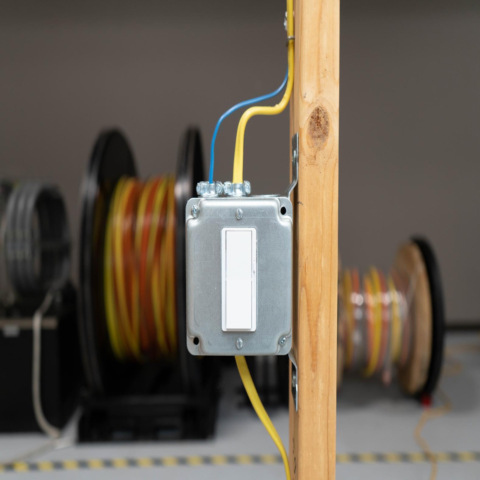 Southwire NM-B cable runs through air voids in block walls.