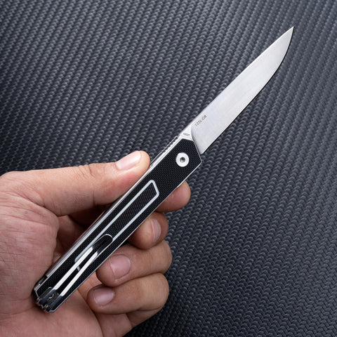SRM folding knife pocket clip keeps it within reach on hikes.