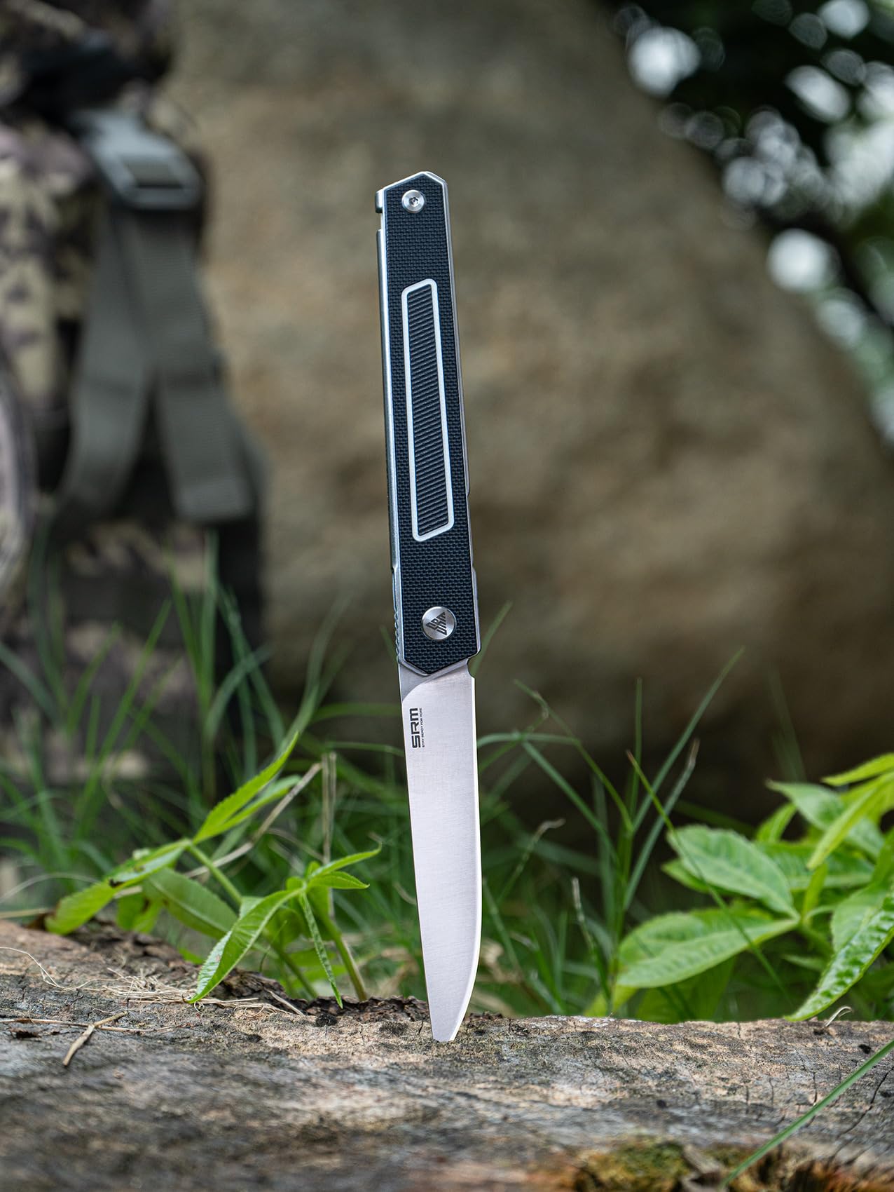 SRM folding knife slim EDC design fits wallets.