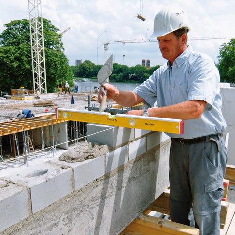 Stabila 48-inch masonry level side view showcasing strike zones and anti-slip end caps.