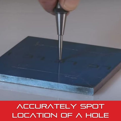 Center punch in use creating a spot for drilling.