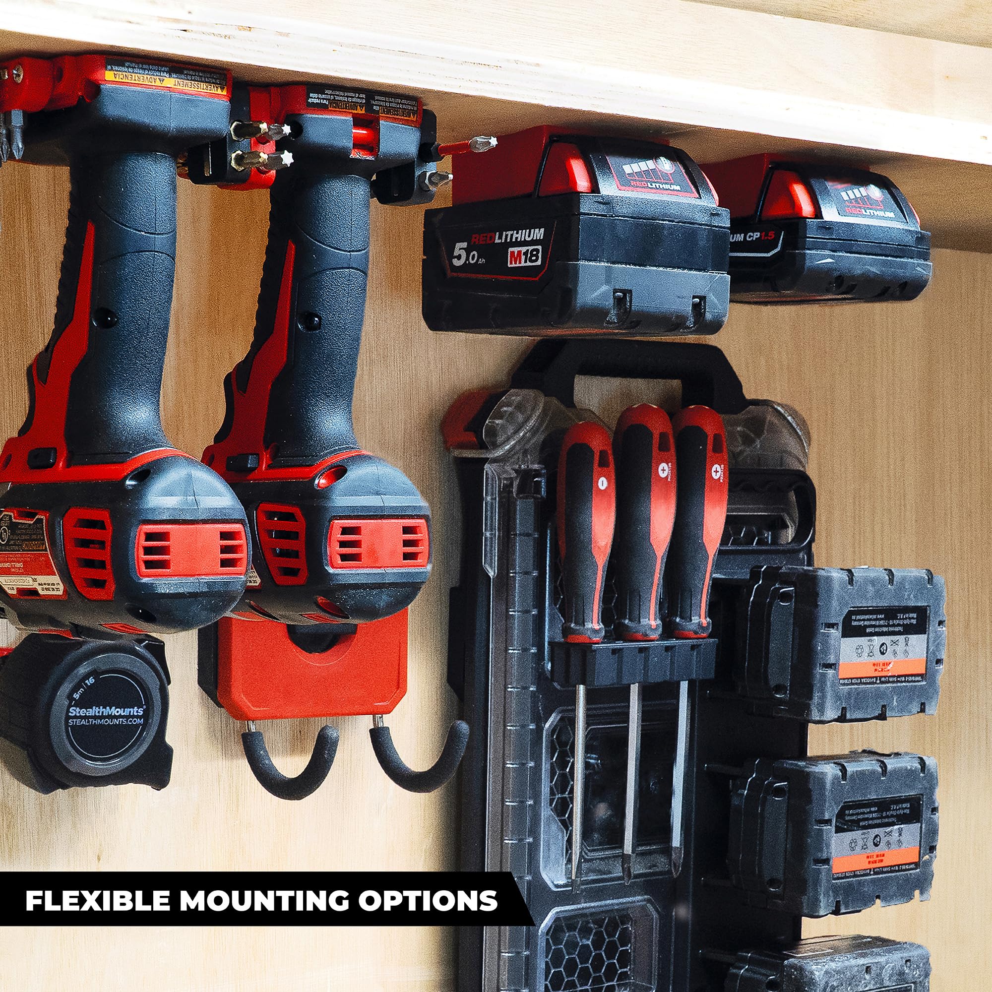 Mounted under a shelf with Milwaukee M18 batteries ready for quick access.