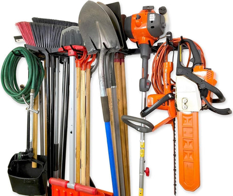 StoreYourBoard wall mount organizes garden tools like shovels and rakes.