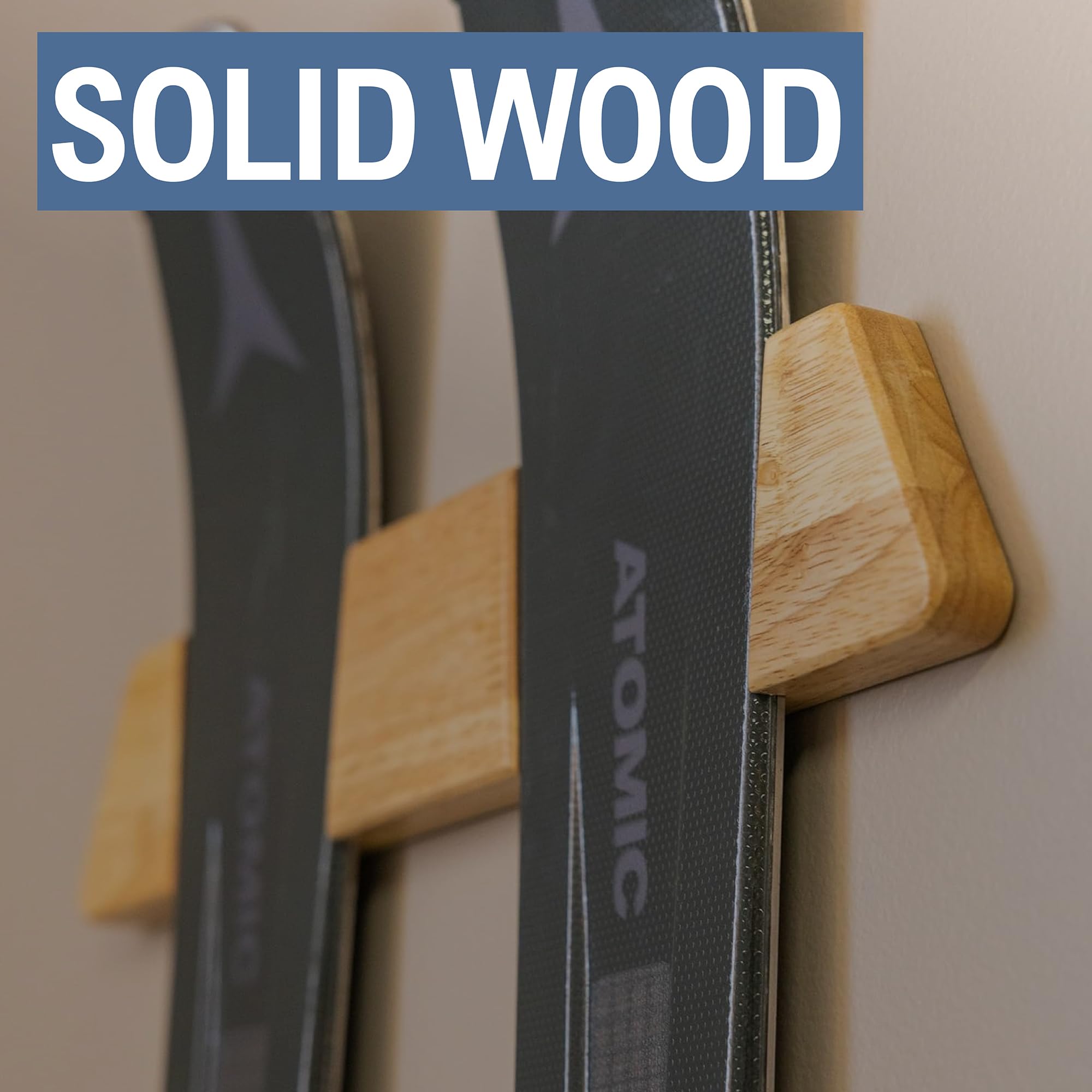 Natural wood texture ski rack on wall adds warmth and durability.