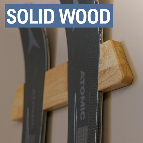 Natural wood texture ski rack on wall adds warmth and durability.