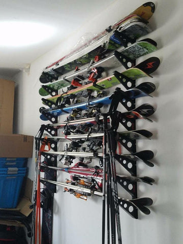 StoreYourBoard snowboard wall mount saving garage space while keeping equipment ready for next ride.