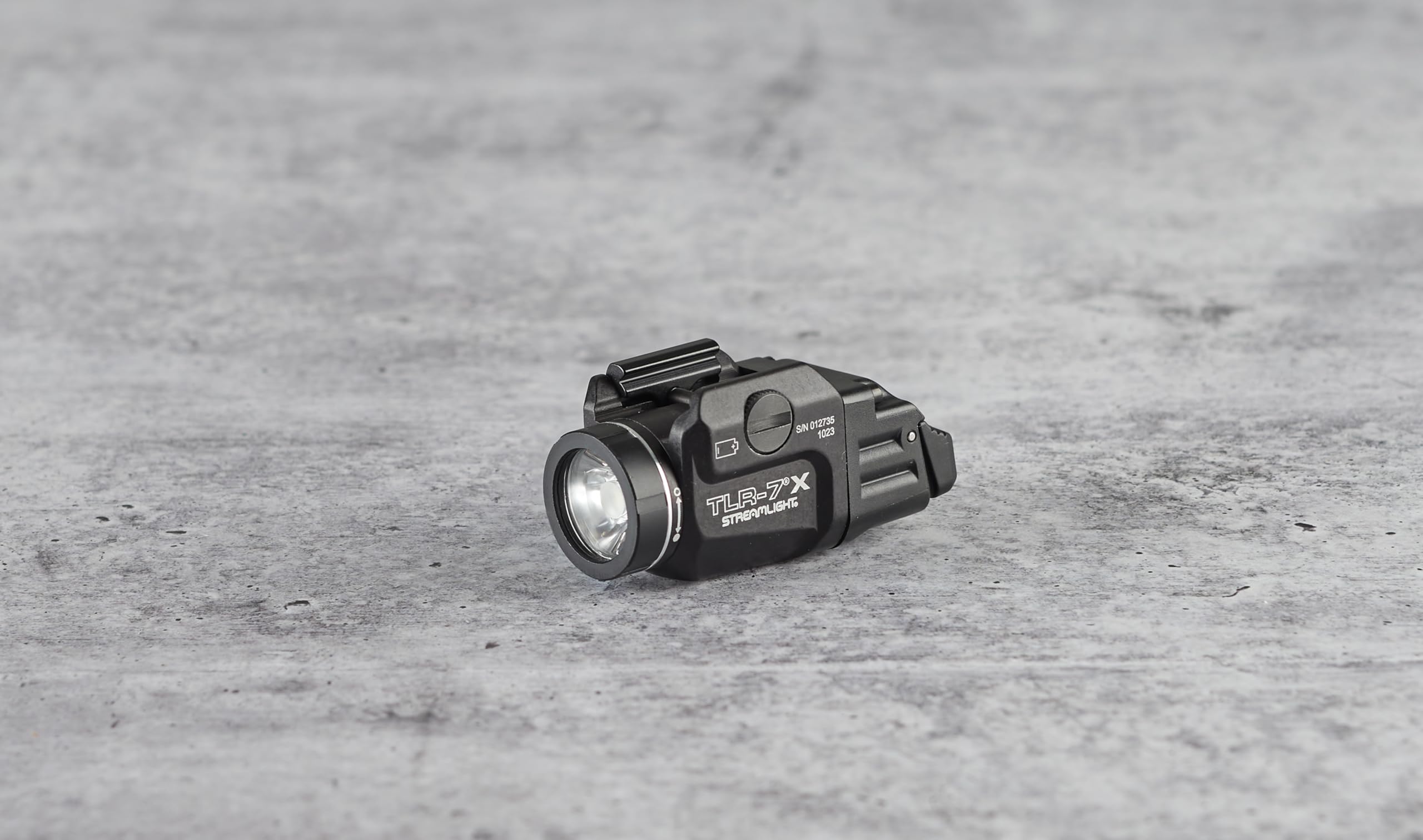 Streamlight TLR-7 X rail clamp for tool-free mounting.