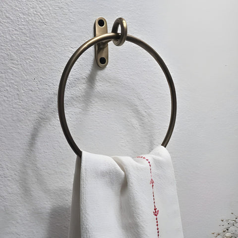 Stylentdecor antique brass round towel ring in bathroom for organized towels.