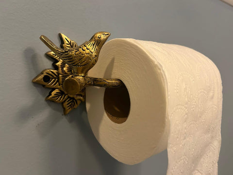 Stylentdecor brass bird toilet paper holder antique finish detail close-up.