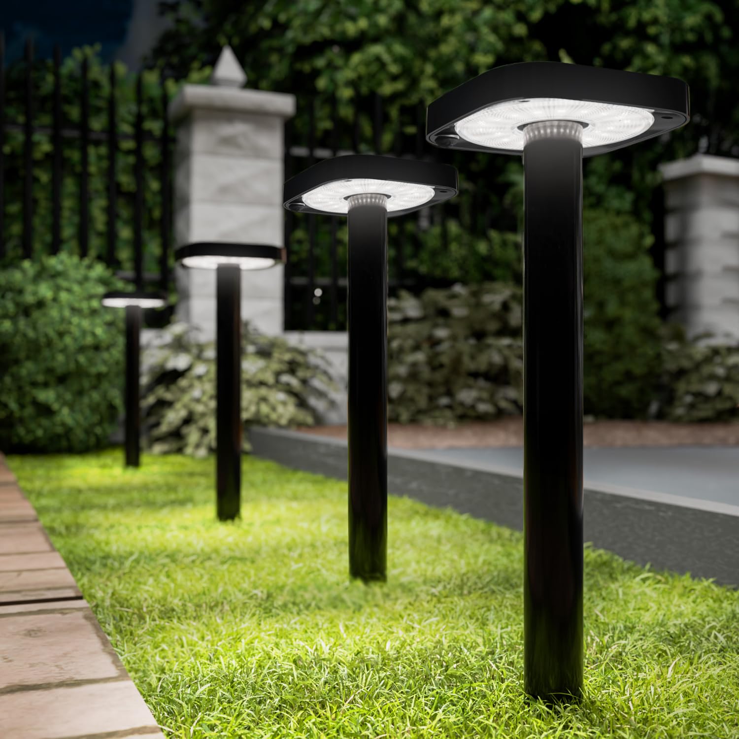 Sunco square solar pathway light front view glows softly along a garden path