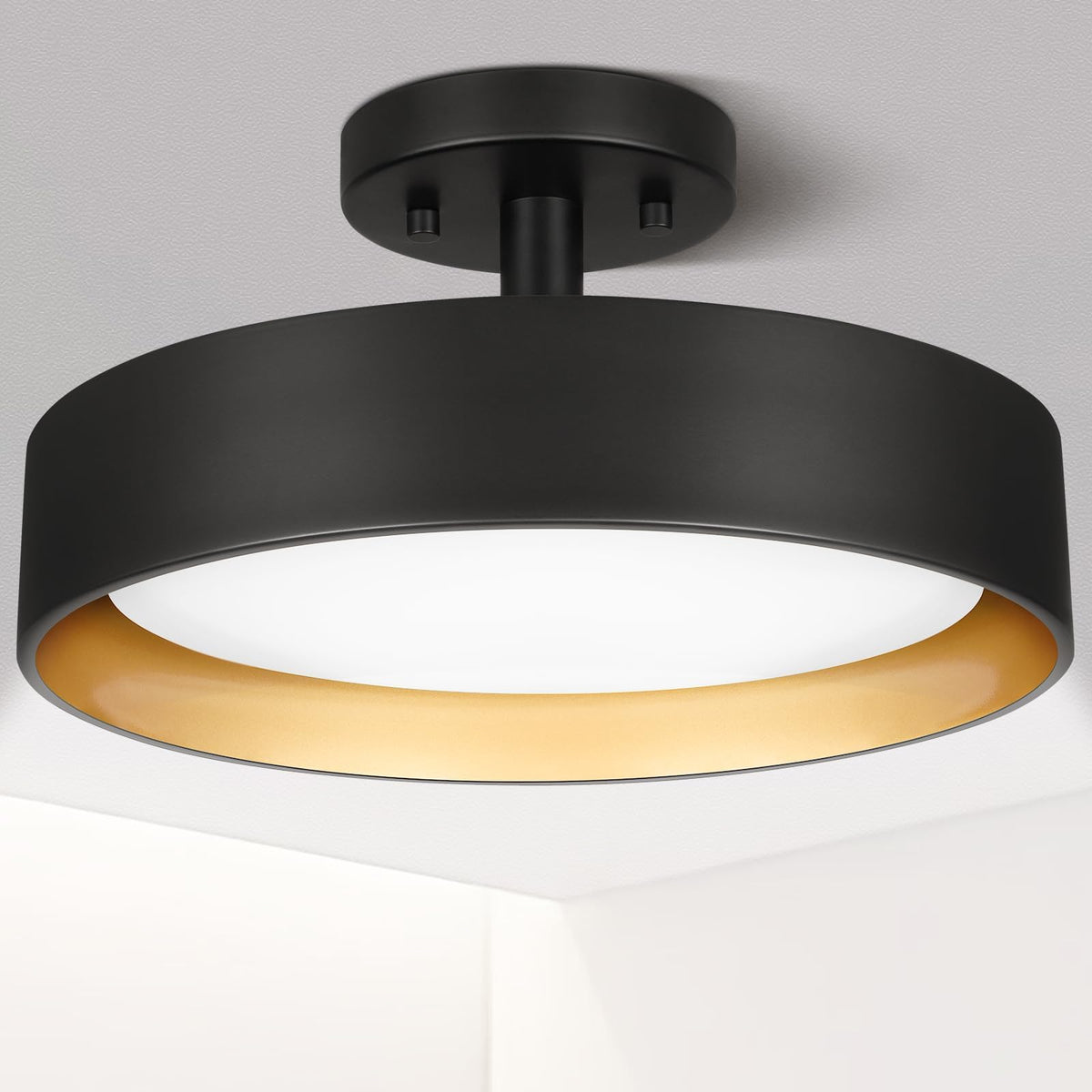 SunRider semi-flush mount with black exterior and gold interior adds vintage-modern elegance to hallways