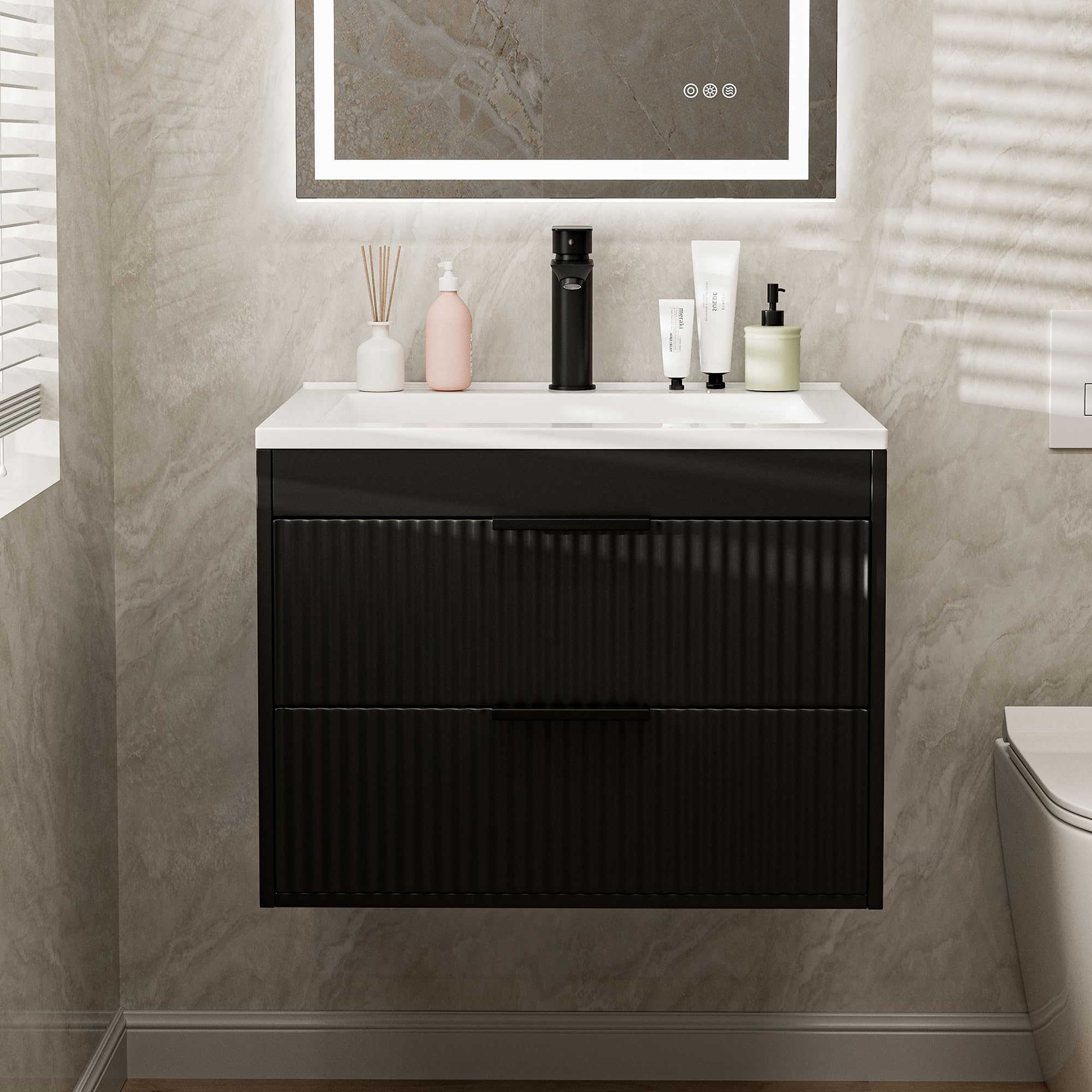 SUNTAGE black handles close-up on a contemporary vanity