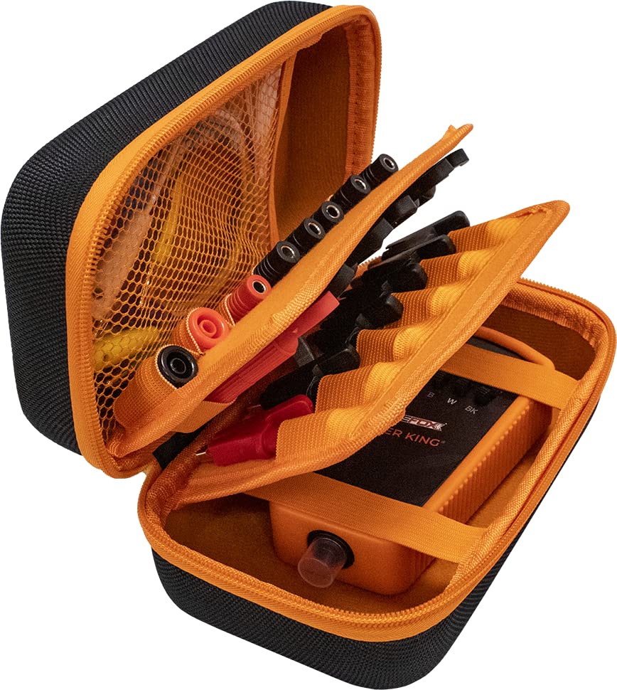 Secure alligator clips grip electrical leads during setup.