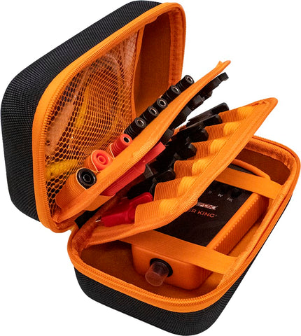 Secure alligator clips grip electrical leads during setup.