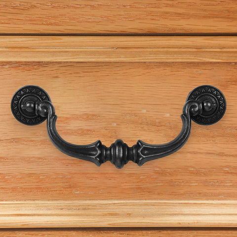 Supkiir drop bail handle in antique black offers comfortable grip.