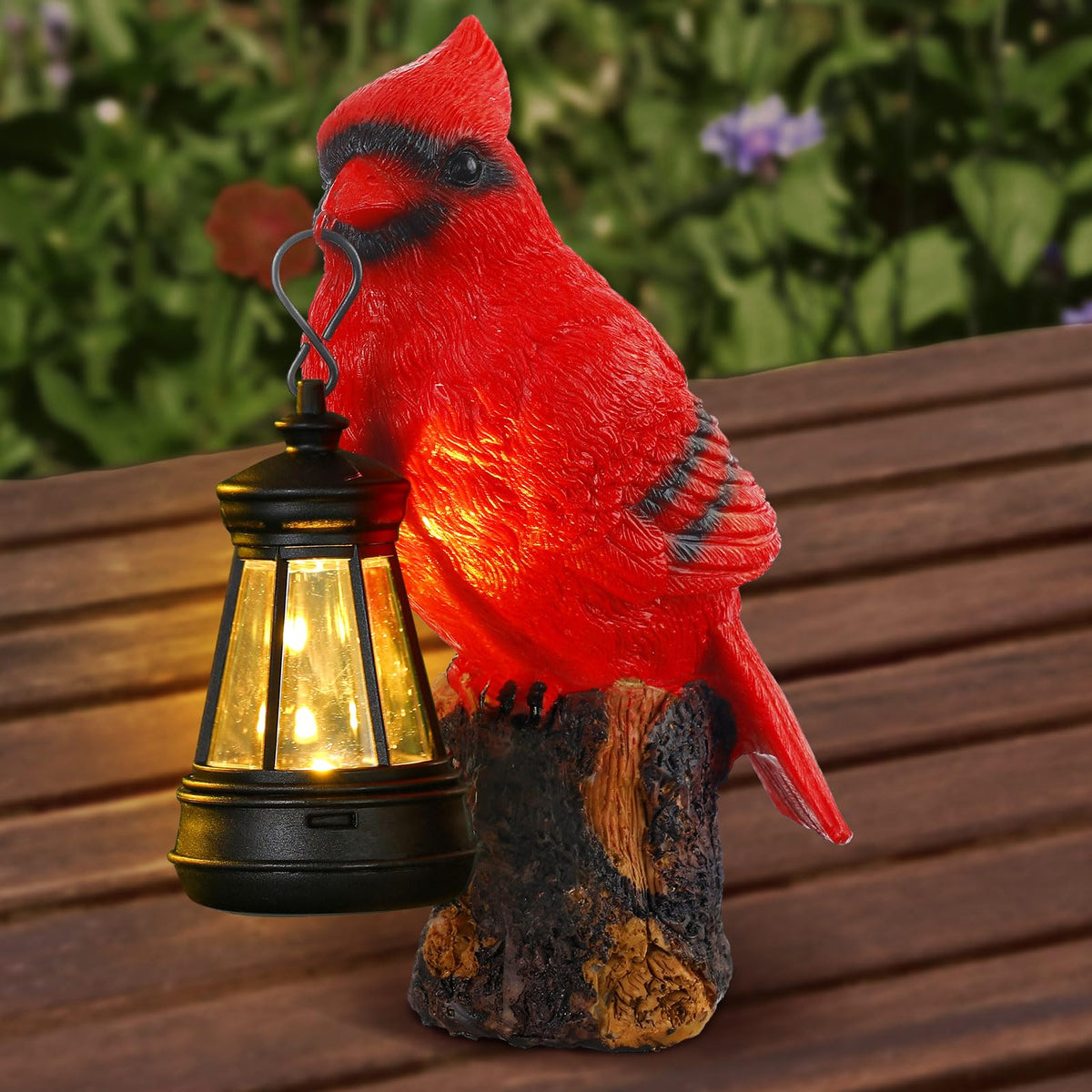 Suzile Cardinal Garden Statue with Solar Lantern glowing at dusk to illuminate a path
