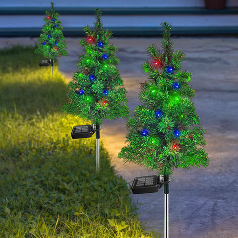 SXXSMYWR solar Christmas tree stake installed in-ground for festive yard mood all night.