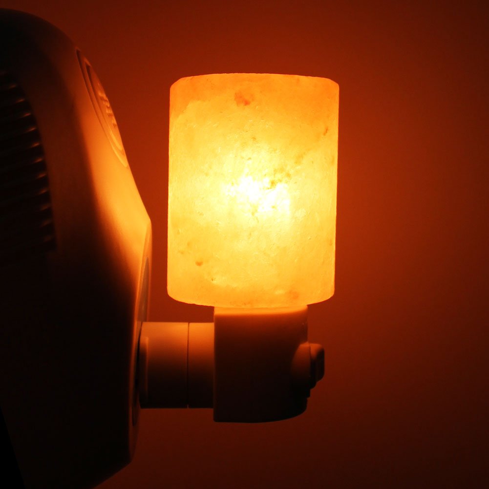 Syntus Himalayan salt lamp glowing amber crystal boosts cozy vibes.
