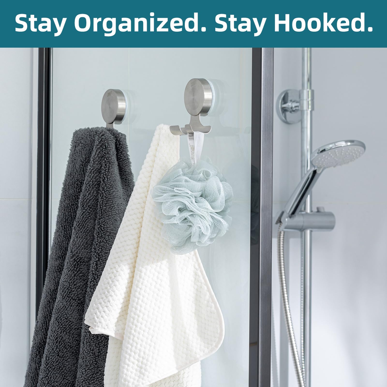 TAILI versatile suction hooks mounted on tile or glass.
