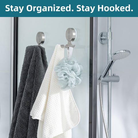 TAILI versatile suction hooks mounted on tile or glass.