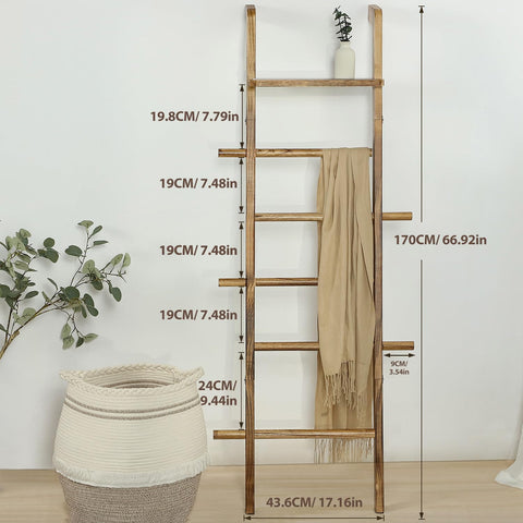 Taozun blanket ladder in living room displaying towels and quilts neatly.