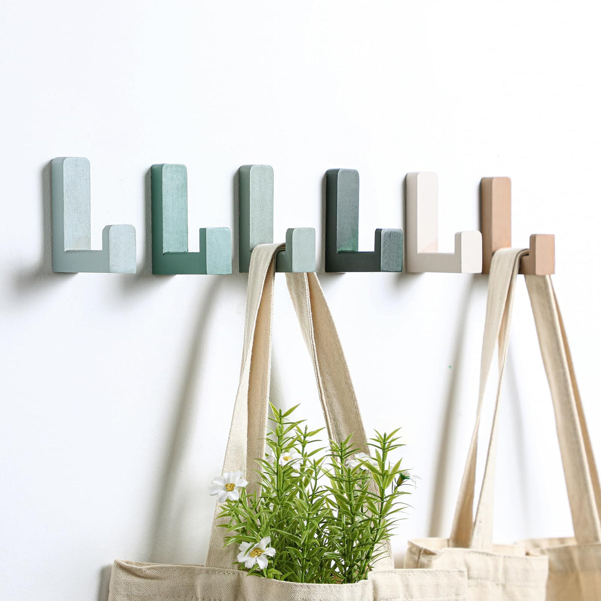 Teenyyou wooden kids wall hooks in green keep coats organized and bright.