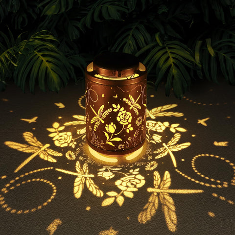 Tepaken dragonfly lantern hanging glows warm solar light for cozy outdoor evenings.