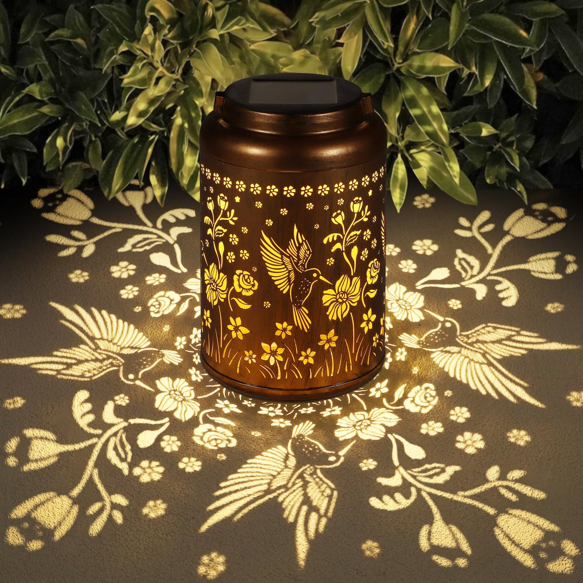 Tepaken solar lantern with hummingbird pattern hanging design provides warm garden ambiance.