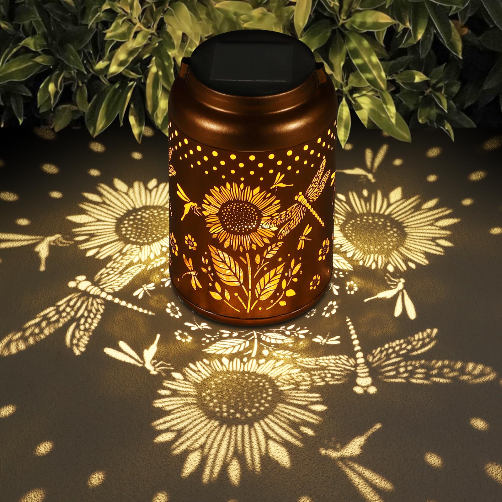 Tepaken solar lantern with hummingbird motif glows softly in the garden.