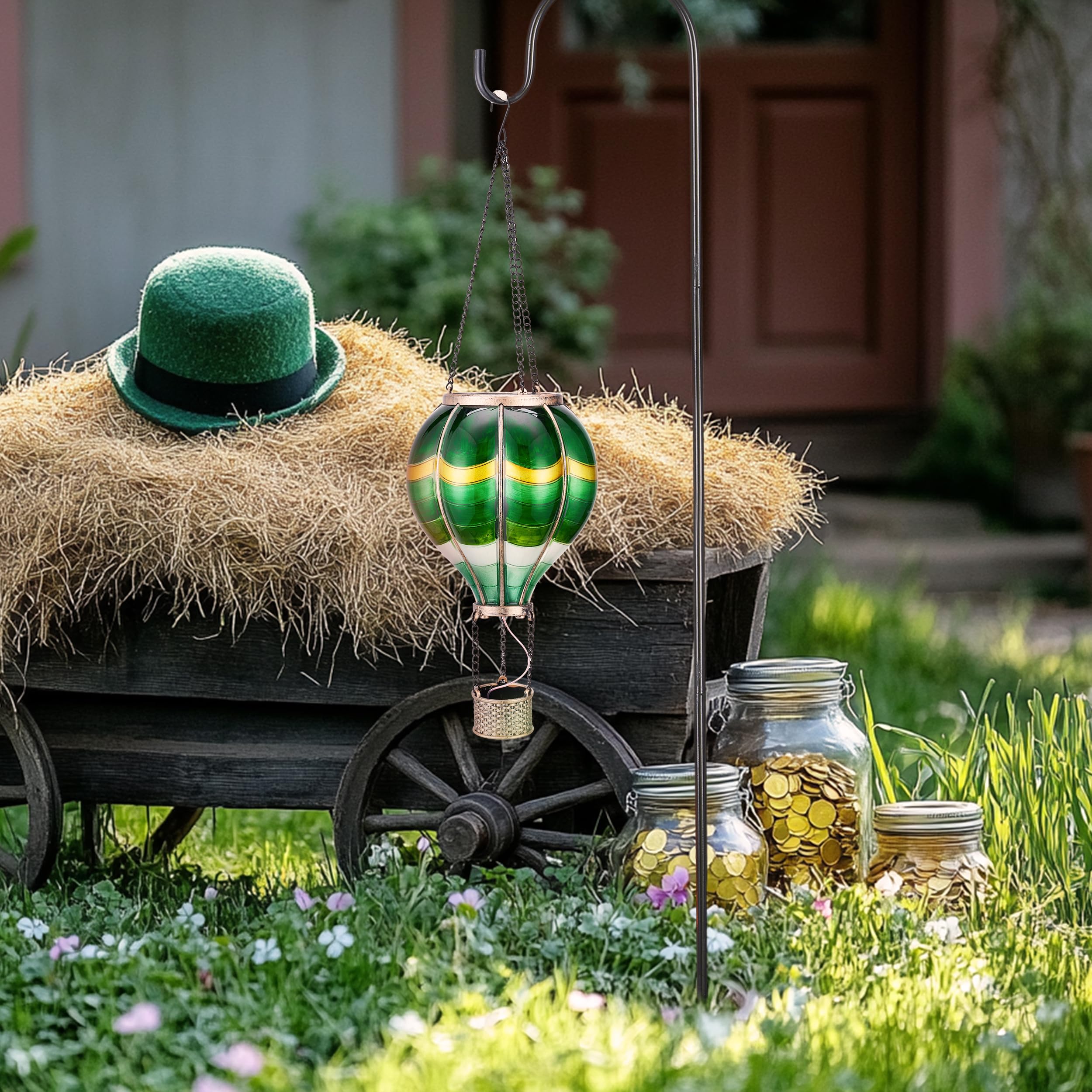 TERESA'S COLLECTIONS lantern hanging in a tree enhances outdoor festive charm