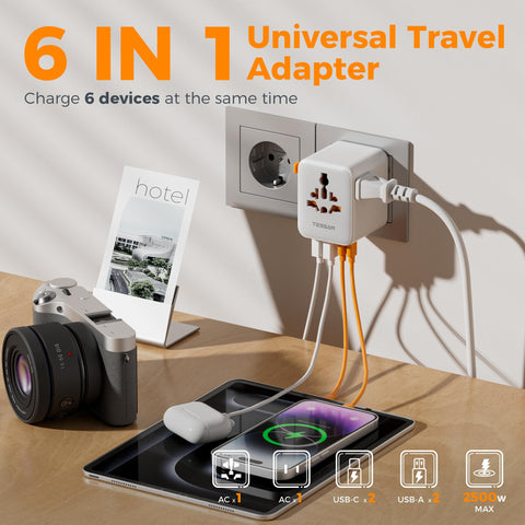 TESSAN universal travel adapter USB ports visible for simultaneous charging.