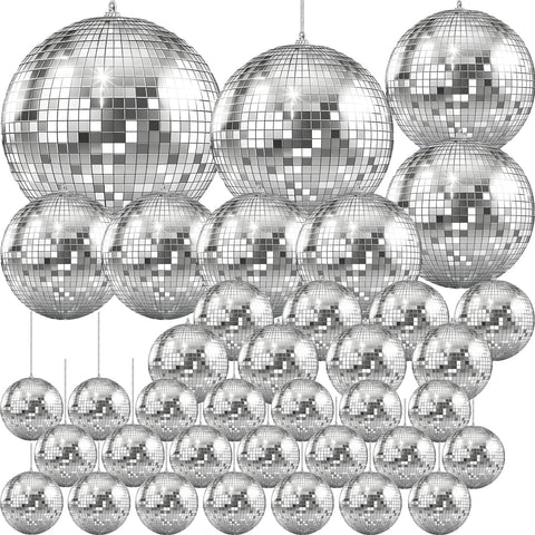 The Dreidel Company Mirror Disco Ball 7-inch hanging creates sparkling reflections for parties.