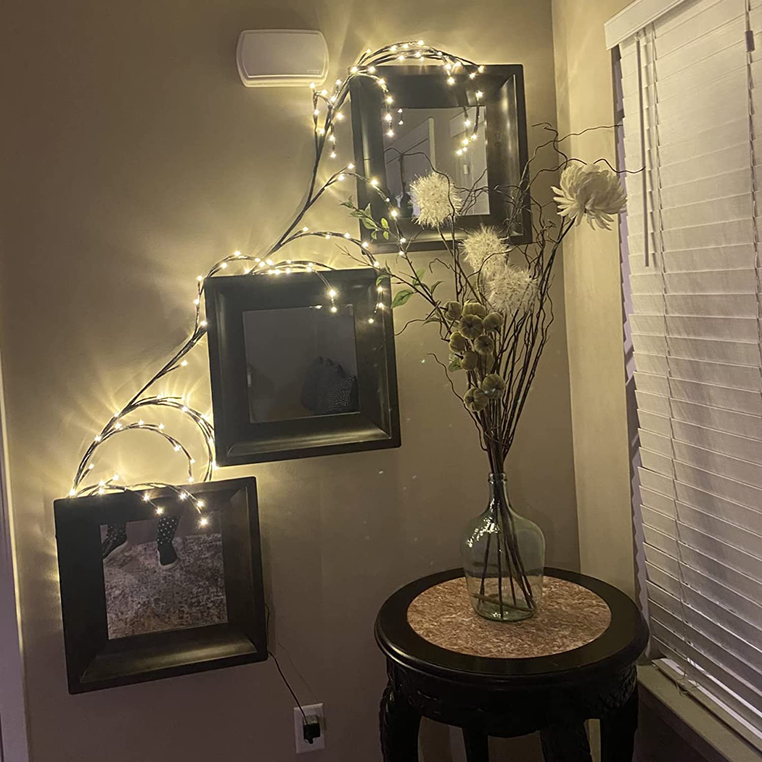 The Light Garden lighted willow vine close-up bulbs highlight decorative details.