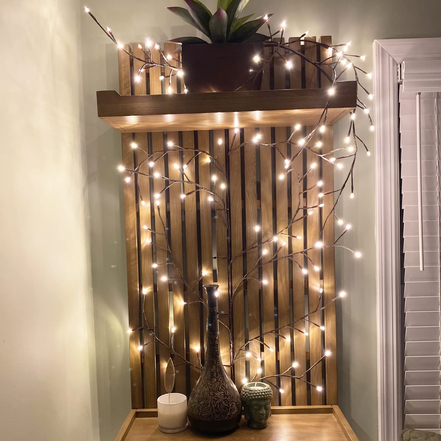 The Light Garden lighted willow vine shelf drape softens shelves with a gentle glow.
