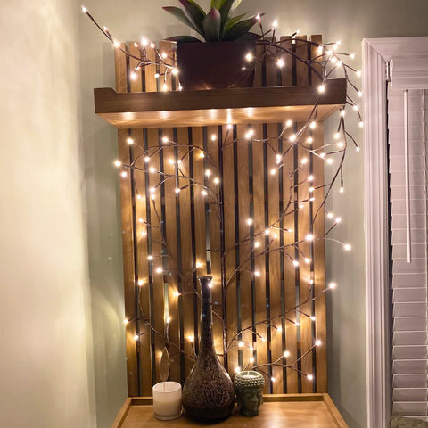 The Light Garden lighted willow vine shelf drape softens shelves with a gentle glow.