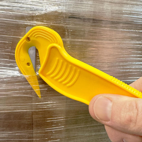 Tape cutting with Thornton's film cutter in fast-paced fulfillment settings