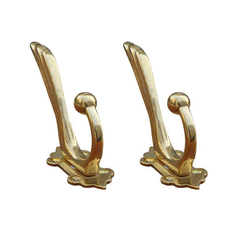 Tiazza antique brass coat hooks on wall mount for sturdy storage of coats and bags.