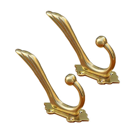 Close-up of Tiazza antique brass hook finish showing craftsmanship and durability.
