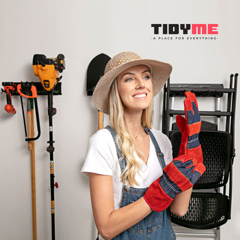 TIDYME organizer holding shovels, rakes, hoses, and power tools neatly.