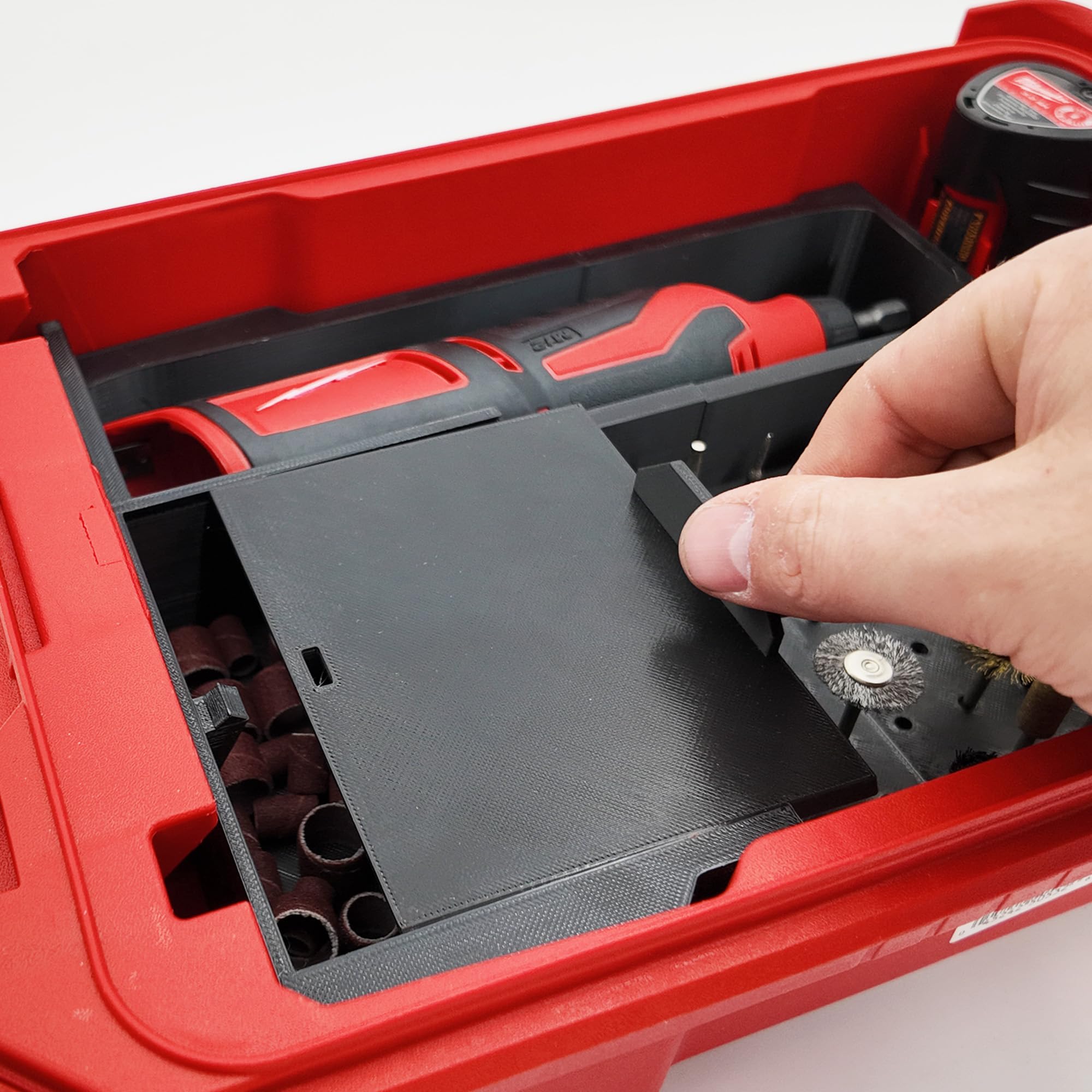 TidyTool liner battery slot secures M12 power packs during transport.