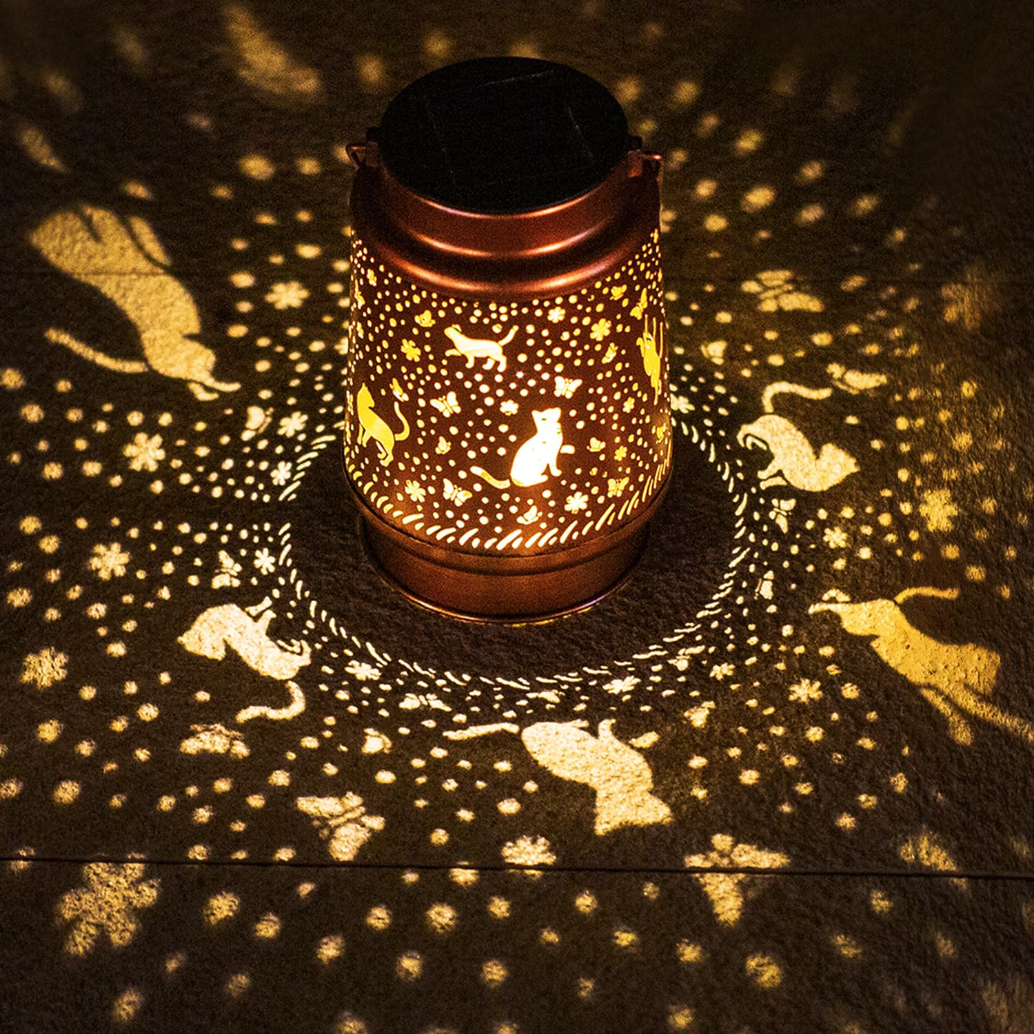 TIGGSY cat solar lantern pattern casts warm light for garden ambiance.
