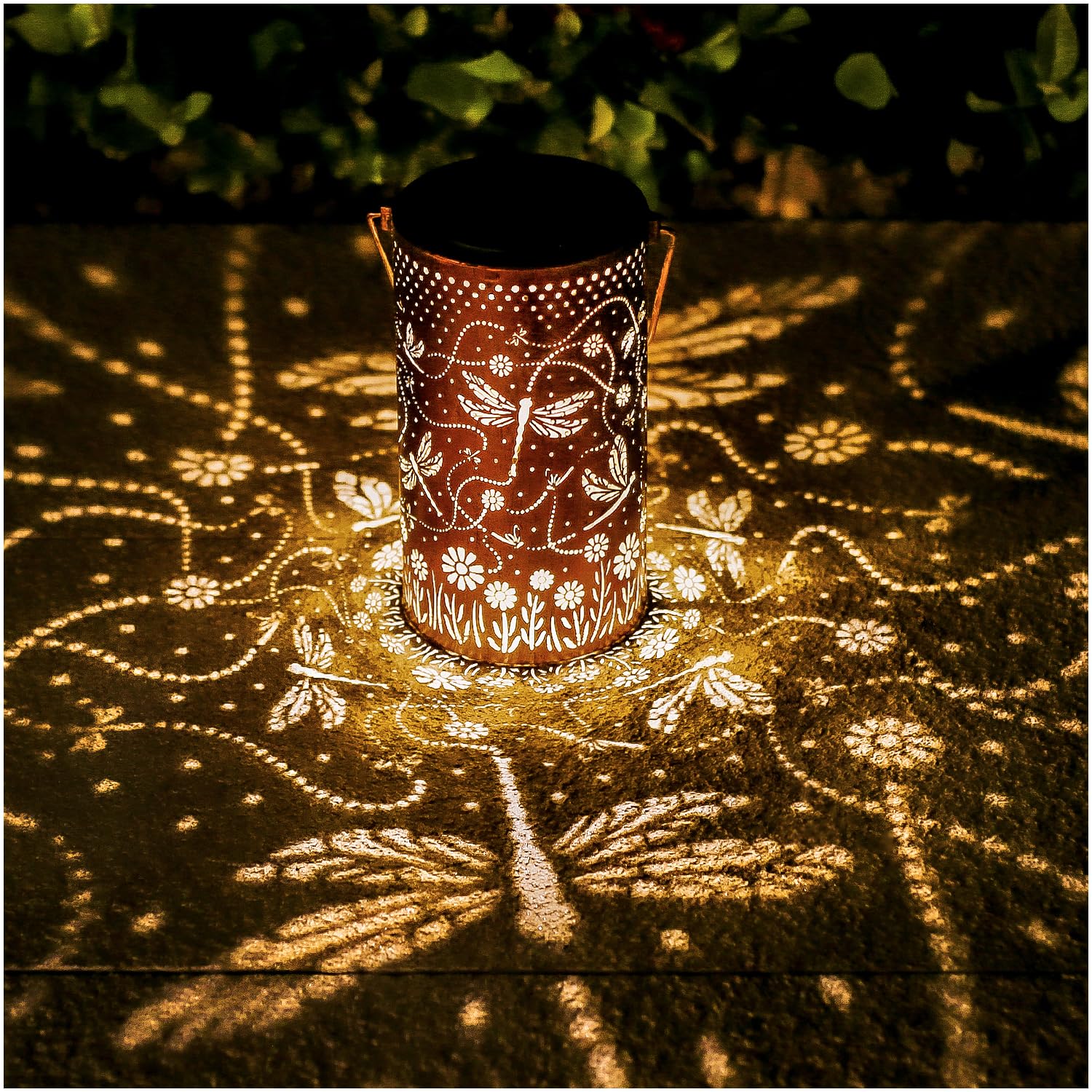 TIGGSY Dragonfly solar lantern hanging outdoors creates a gentle evening ambiance.