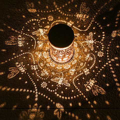 TIGGSY outdoor metal bee lantern highlights pathways with energy-efficient lighting.