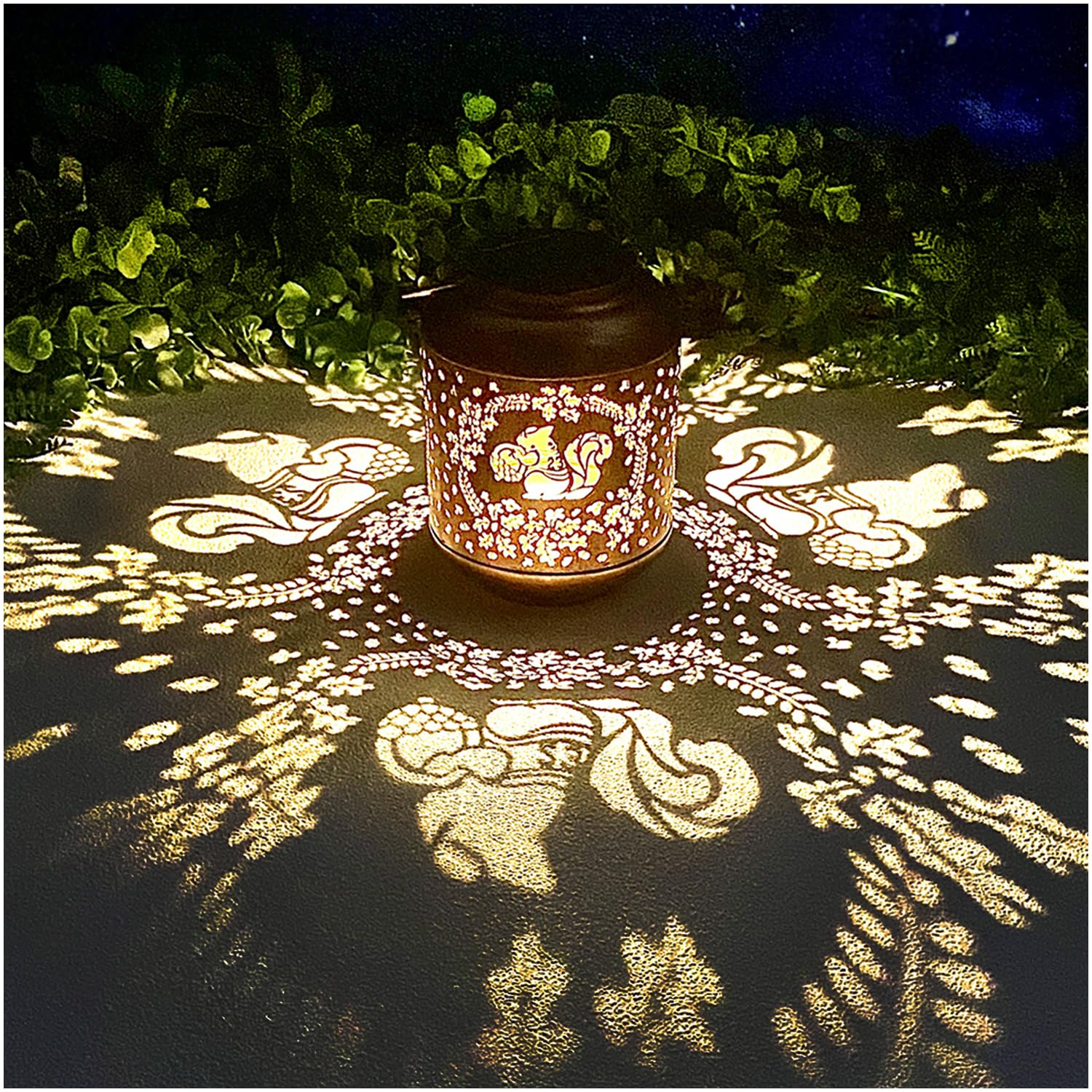 TIGGSY Squirrel Solar Lantern in a garden casting charming shadows at night