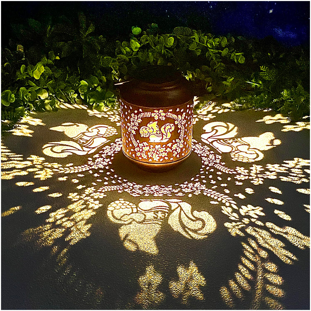 TIGGSY Squirrel Solar Lantern in a garden casting charming shadows at night
