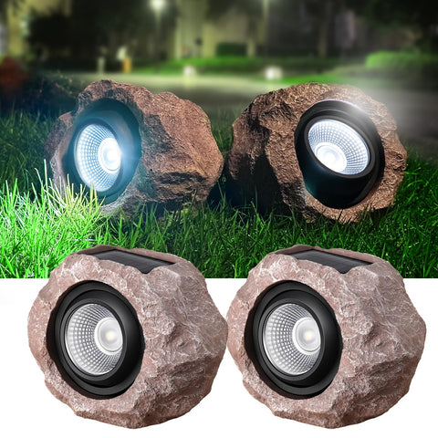 Timeflies Solar Rock Light two-pack illuminating garden paths with bright ambient glow.