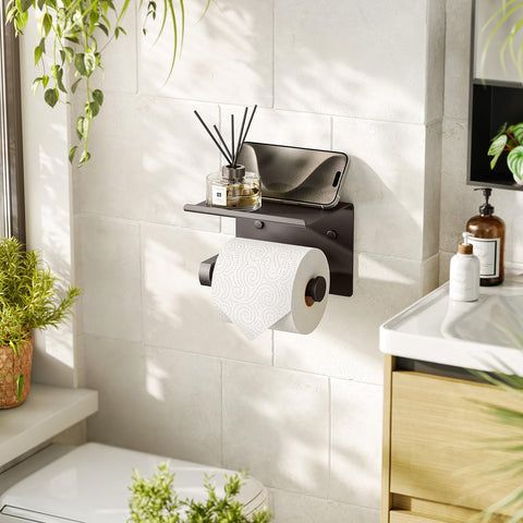 Tindbea phone shelf attached to toilet paper holder keeps device secure in bathroom