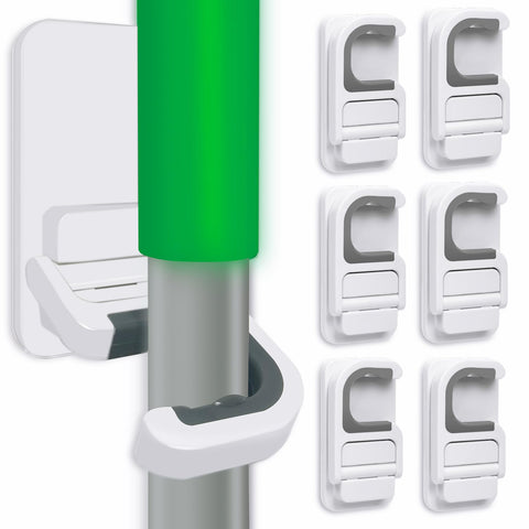 Tinkeep broom holder attached to wall offers easy, clutter-free storage.